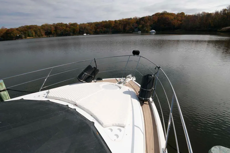 Slide: The Image of 2007 Carver 43 Motor Yacht on serene lake with autumn trees. - 14