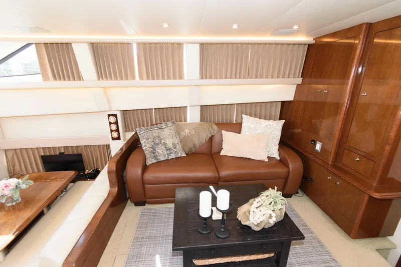 Slide: The Image of Luxurious interior of a 2007 Carver 43 Motor Yacht with leather sofa and elegant decor. - 19