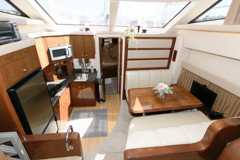 Slide: The Image of Interior of 2007 Carver 43 Motor Yacht with kitchen and dining area. - 23