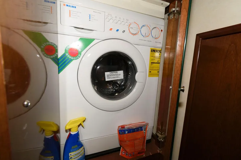 Slide: The Image of Washer and dryer unit in 2007 Carver 43 Motor Yacht laundry area. - 31