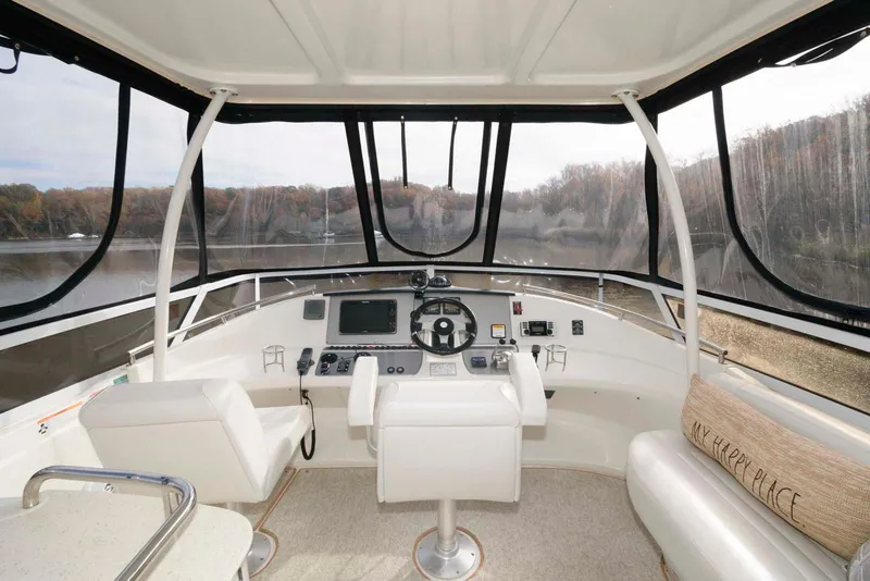 Slide: The Image of Interior helm of 2007 Carver 43 Motor Yacht with panoramic windows and modern controls. - 7