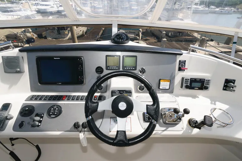 Slide: The Image of Helm of 2007 Carver 43 Motor Yacht with advanced navigation controls and steering wheel. - 11