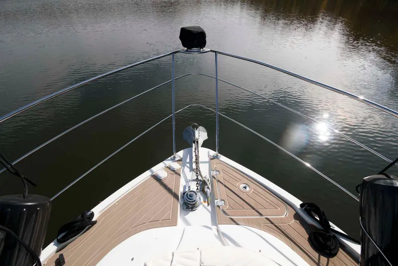 Slide: The Image of Bow view of 2007 Carver 43 Motor Yacht on calm water. - 15