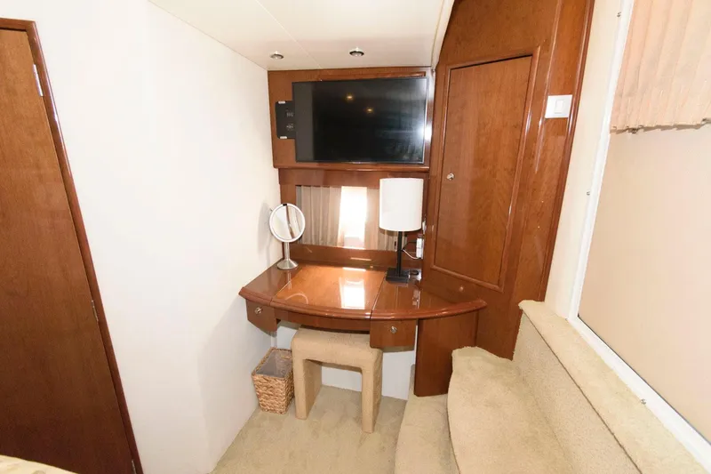 Slide: The Image of Interior of 2007 Carver 43 Motor Yacht with desk, TV, and lamp. - 26