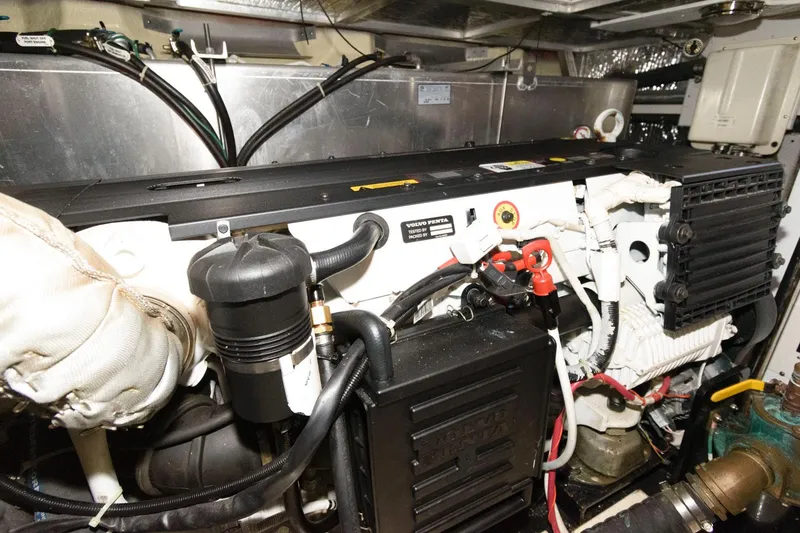 Slide: The Image of Engine room of a 2007 Carver 43 Motor Yacht with visible components. - 33