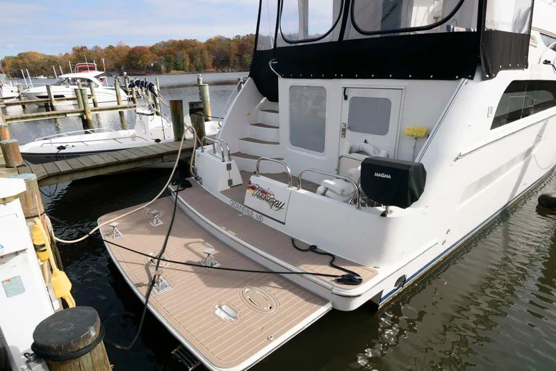 Slide: The Image of 2007 Carver 43 Motor Yacht docked at marina, rear view. - 4