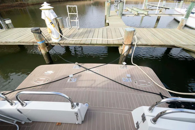 Slide: The Image of Carver 43 Motor Yacht 2007 docked at a wooden pier with mooring lines. - 6