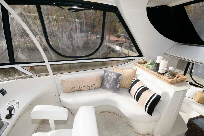 Slide: The Image of Luxurious 2007 Carver 43 Motor Yacht interior with cozy seating and decorative pillows. - 9