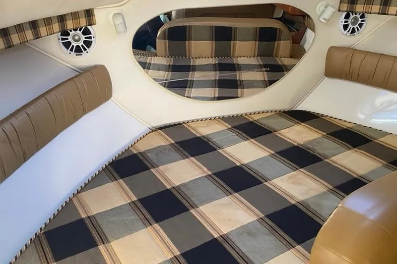 Slide: The Image of Interior of 2004 Monterey 282 Cruiser with plaid upholstery and speaker system. - 13