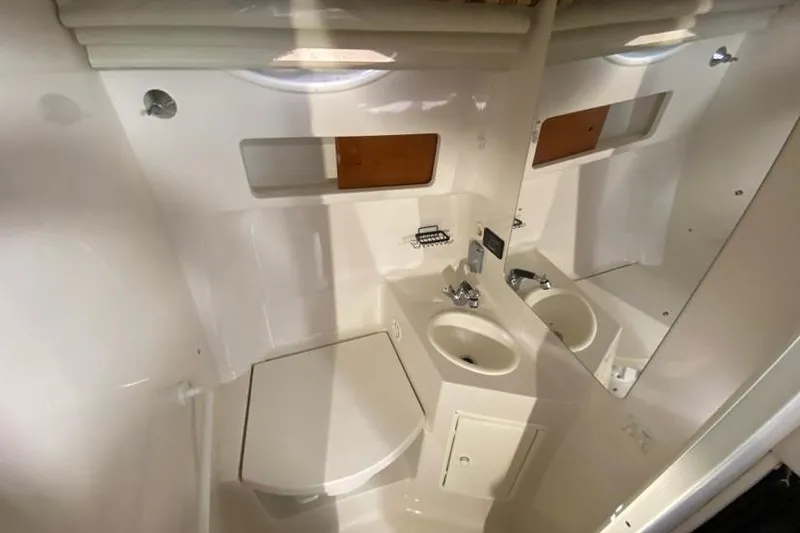 Slide: The Image of 2004 Monterey 282 Cruiser bathroom with sink, mirror, and storage. - 15