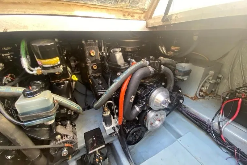 Slide: The Image of Engine compartment of a 2004 Monterey 282 Cruiser boat, showcasing mechanical components. - 17