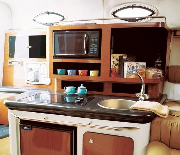 Slide: The Image of 2004 Monterey 282 Cruiser interior with white seating and modern dashboard. - 4