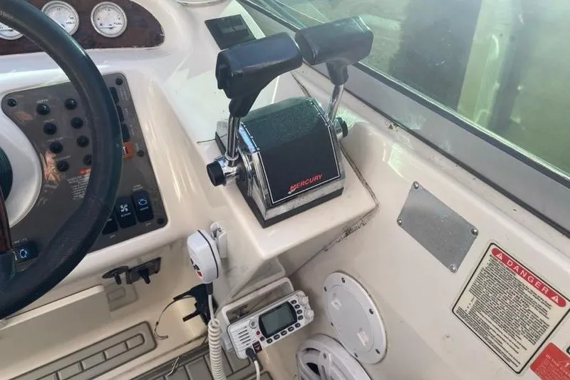 Slide: The Image of Control panel of a 2004 Monterey 282 Cruiser boat with Mercury throttle. - 6