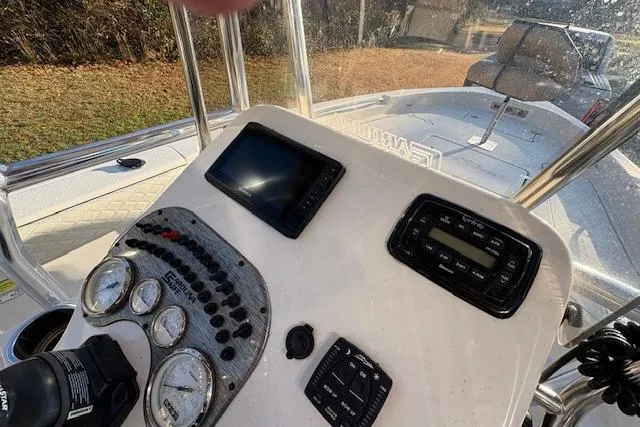 Slide: The Image of 2023 Sea Chaser 21 LX boat dashboard with gauges and navigation equipment. - 5