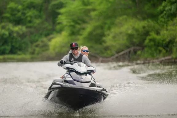 Slide: The Image of 2026 Yamaha WaveRunner VX Cruiser HO on a scenic waterway with two riders. - 3