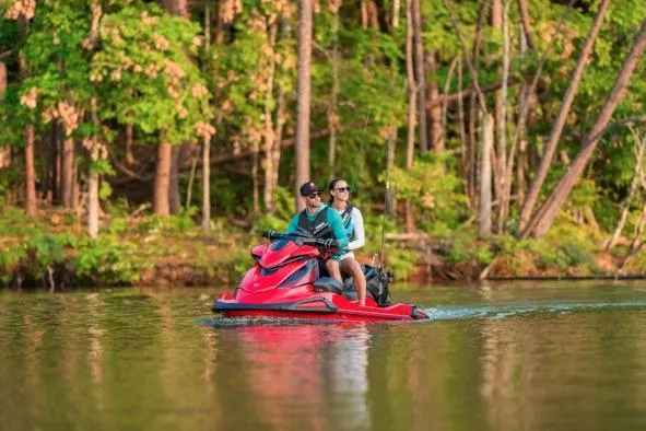 Slide: The Image of Two people riding a 2026 Yamaha WaveRunner VX Deluxe on a calm lake. - 3