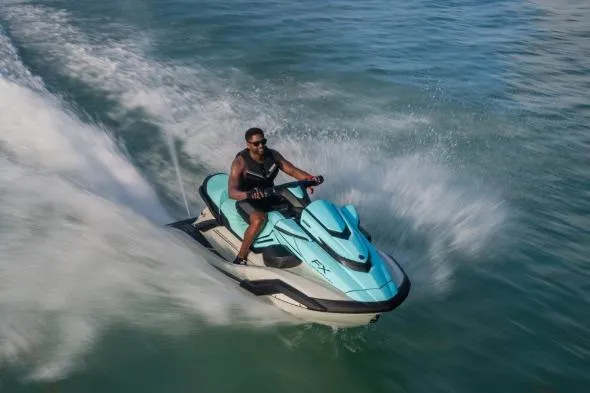 Slide: The Image of 2026 Yamaha WaveRunner FX Cruiser HO speeding on water with rider. - 3