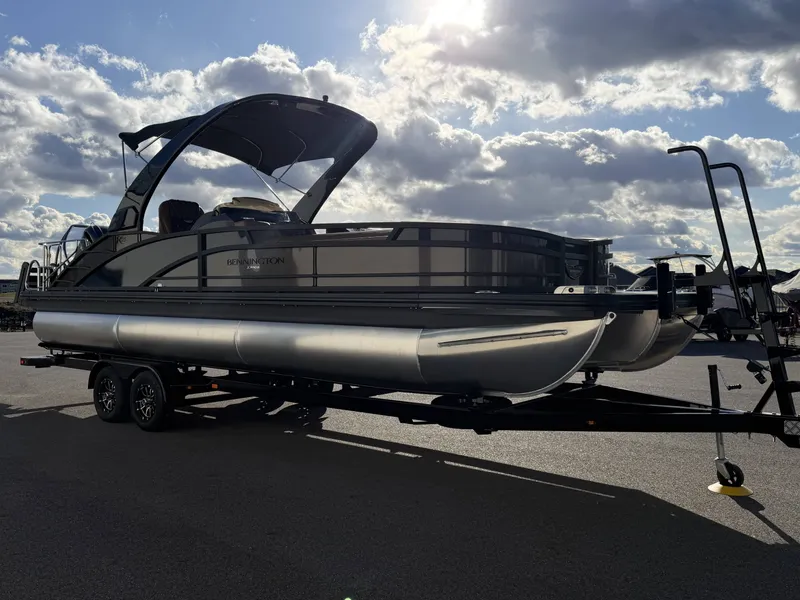 Slide: The Image of 2026 Bennington 25 RTSBA pontoon boat on trailer at sunset. - 20