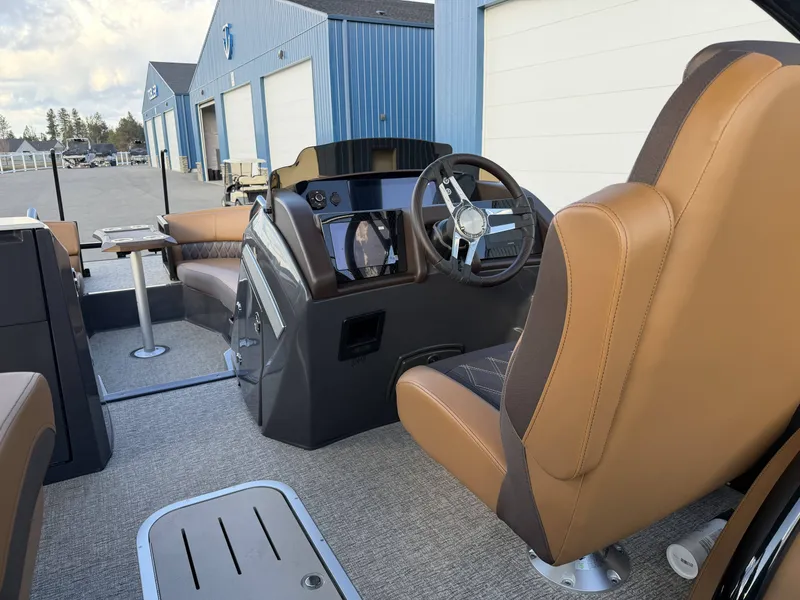 Slide: The Image of Interior of 2026 Bennington 25 RTSBA with brown leather seats. - 28