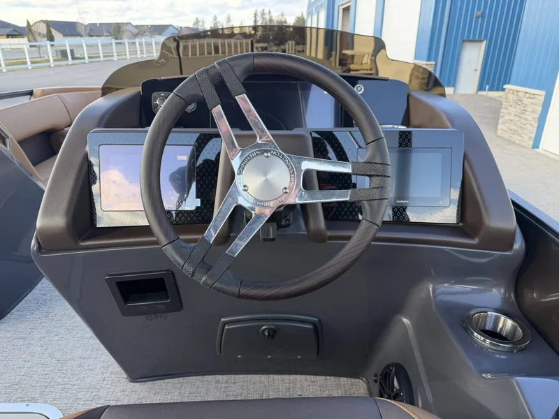 Slide: The Image of Steering wheel of 2026 Bennington 25 RTSBA with modern displays. - 30