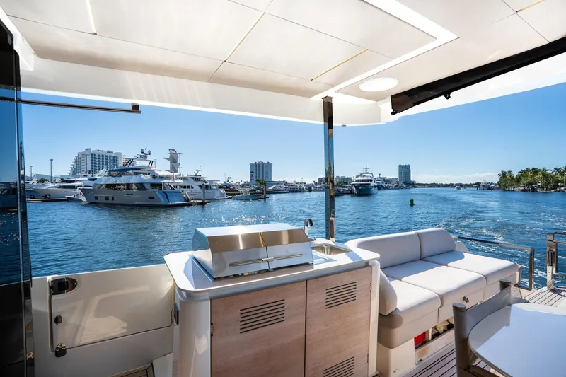 Slide: The Image of Luxurious 2022 Prestige X70 yacht interior with waterfront view and modern amenities. - 16