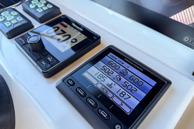Slide: The Image of Control panel of a 2022 Prestige X70 yacht displaying engine and navigation data. - 29