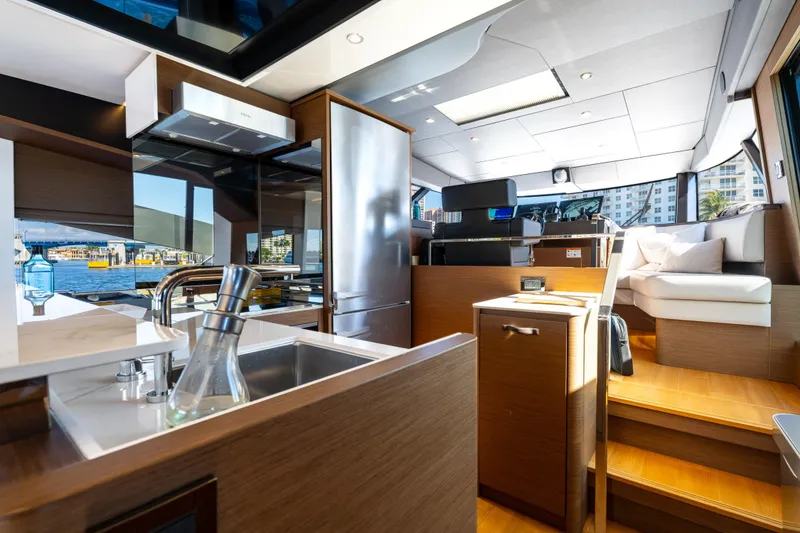 Slide: The Image of Luxurious interior of 2022 Prestige X70 yacht with modern kitchen and seating area. - 37