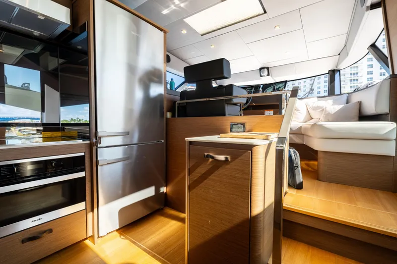 Slide: The Image of Luxurious interior of 2022 Prestige X70 yacht with modern kitchen and seating area. - 38