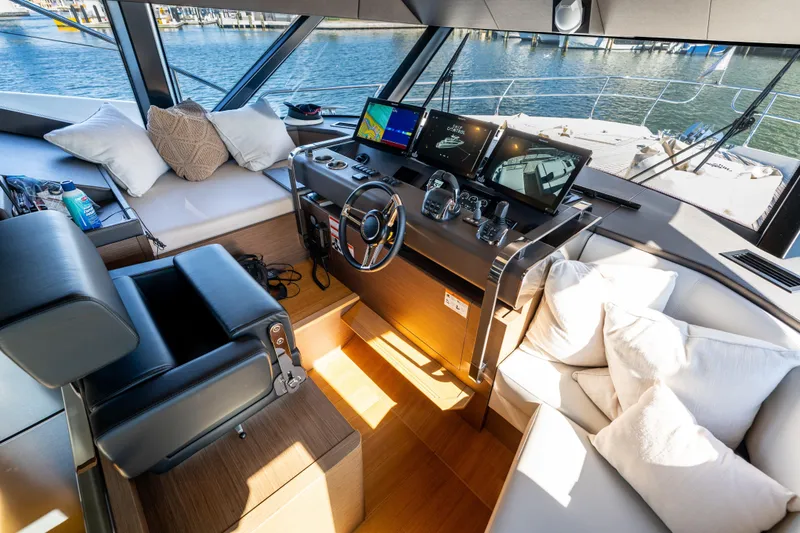 Slide: The Image of Luxurious 2022 Prestige X70 yacht interior with modern helm and plush seating. - 42