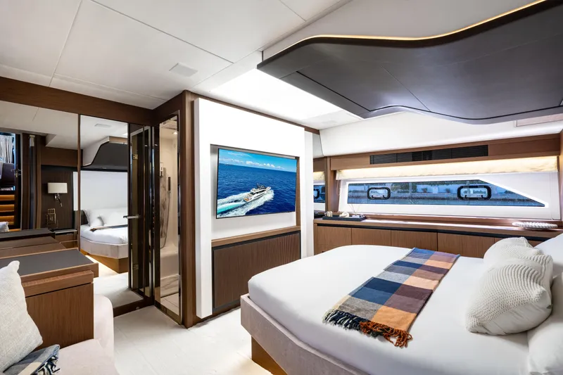 Slide: The Image of Luxurious interior of 2022 Prestige X70 yacht with modern bedroom and ocean view. - 47