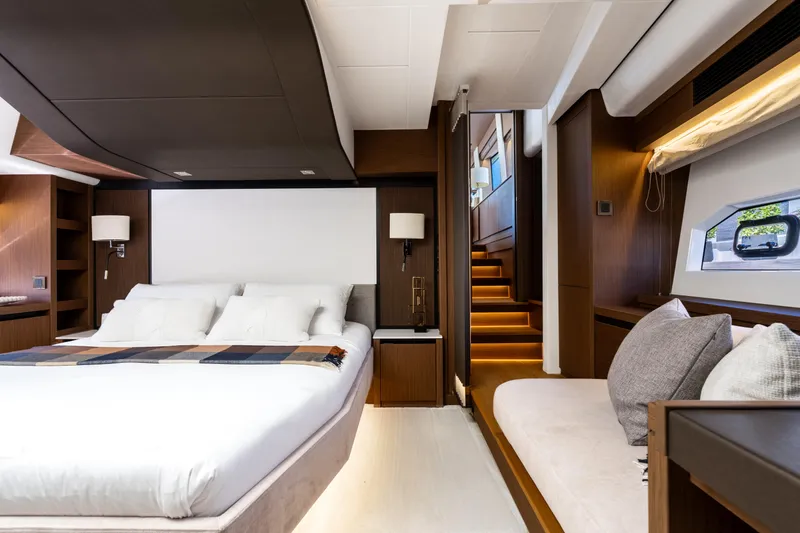 Slide: The Image of Luxurious 2022 Prestige X70 yacht bedroom with modern design and elegant furnishings. - 48