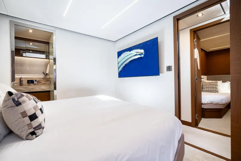 Slide: The Image of Luxurious 2022 Prestige X70 yacht bedroom with modern decor and elegant furnishings. - 52