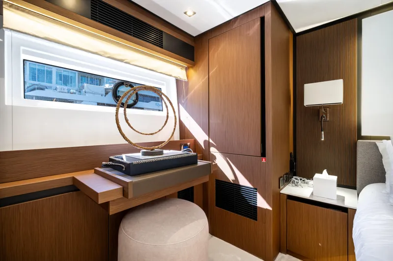 Slide: The Image of Luxurious interior of 2022 Prestige X70 yacht with modern wooden decor and elegant furnishings. - 53