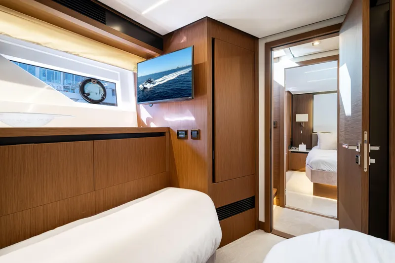 Slide: The Image of Luxurious interior of 2022 Prestige X70 yacht with modern wood finishes and cozy bedrooms. - 59