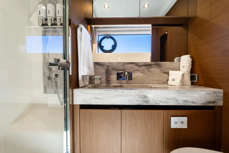 Slide: The Image of Luxurious bathroom in 2022 Prestige X70 yacht with modern fixtures and elegant design. - 60