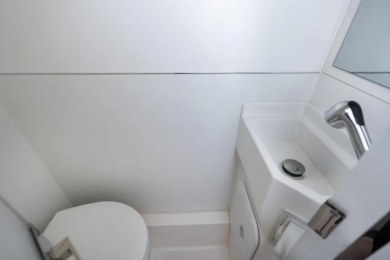 Slide: The Image of Compact bathroom in 2022 Prestige X70 yacht with modern sink and toilet. - 62