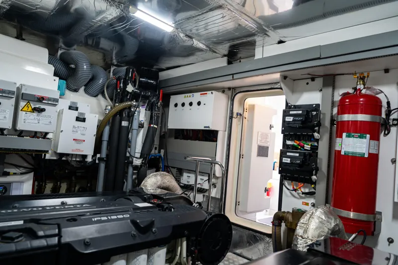 Slide: The Image of Engine room of 2022 Prestige X70 yacht with advanced equipment and safety systems. - 65
