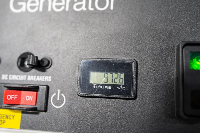 Slide: The Image of Control panel of a 2022 Prestige X70 generator showing 312.6 hours. - 68