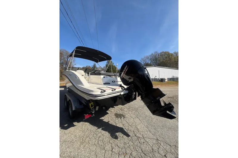 Slide: The Image of 2023 Sea Ray SPX 210 Outboard boat with Mercury engine on trailer. - 12