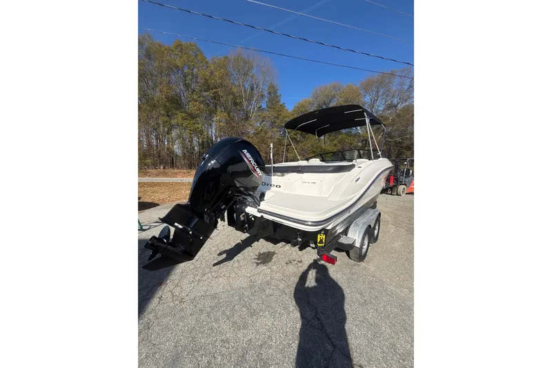 Slide: The Image of 2023 Sea Ray SPX 210 Outboard boat on trailer, parked outdoors. - 14