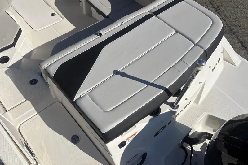 Slide: The Image of 2023 Sea Ray SPX 210 Outboard boat interior with cushioned seating and sleek design. - 15