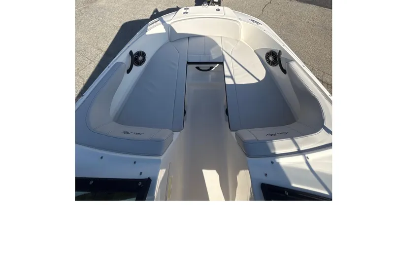 Slide: The Image of 2023 Sea Ray SPX 210 Outboard boat interior with cushioned seating and speakers. - 24