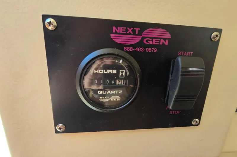 Slide: The Image of Hour meter panel on 2001 Mainship 30 Pilot Rum Runner boat. - 19