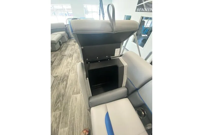 Slide: The Image of 2026 Bentley Pontoons Bolt interior storage compartment with open seat, modern design. - 10