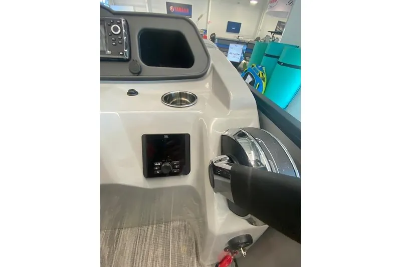 Slide: The Image of 2026 Bentley Pontoons Bolt dashboard with steering wheel and control panel. - 12