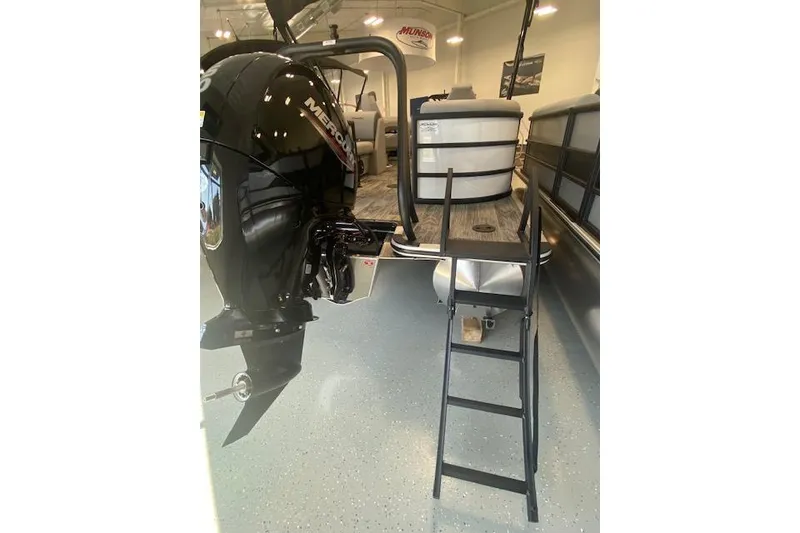 Slide: The Image of 2026 Bentley Pontoons Legacy 223 Navigator with Mercury outboard motor and boarding ladder. - 26