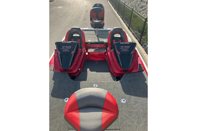 Slide: The Image of 2026 Nitro Z19 XL boat interior with red and gray seating, showcasing sleek design. - 9