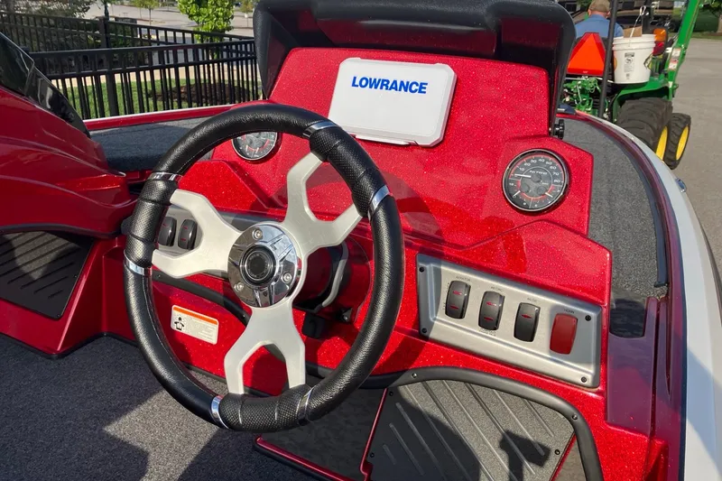Slide: The Image of Steering wheel and dashboard of 2026 Nitro Z19 XL boat with Lowrance display. - 6