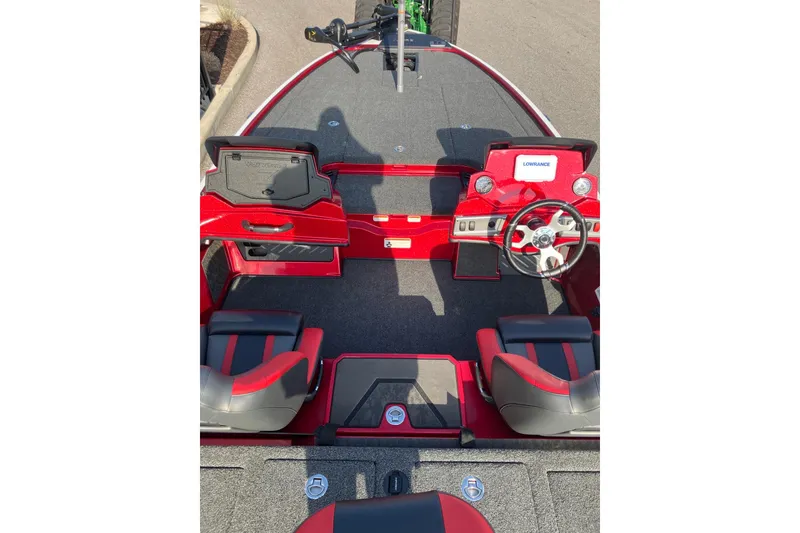 Slide: The Image of 2026 Nitro Z19 XL boat interior with red and black seating, steering wheel, and dashboard. - 7