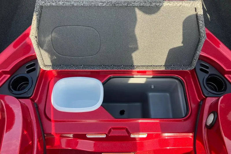 Slide: The Image of Open storage compartment in a 2026 Nitro Z19 XL boat, featuring cup holders and a lined interior. - 11